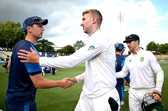 Proteas skipper Neil Brand exchanges pleasantries with Black Caps bowler Matt Henry. (Photo by Hannah Peters/Getty Images)