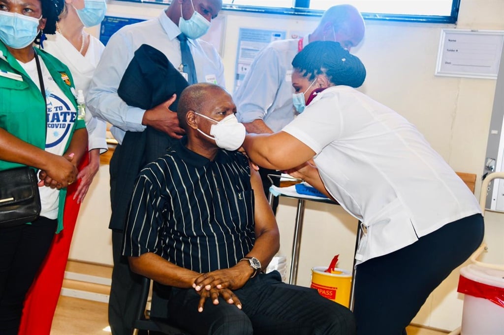 Health Minister Zweli Mkhize receives a vaccine jab at Khayelitsha District Hospital in Cape Town.