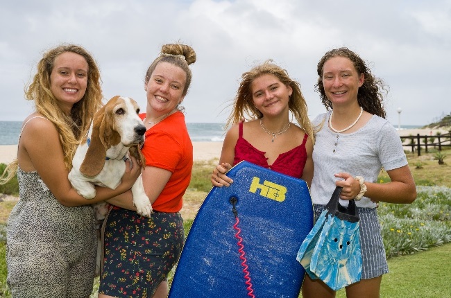 Lisa Stumpf, Megan Johnson, Abbygail Janse Van Rensburg and Karla Stumpf swim 100 m into the sea to save drowning girl. With the girls is Kevin the dog, who waited on the beach while the rescue took place (Photo: Supplied) 
