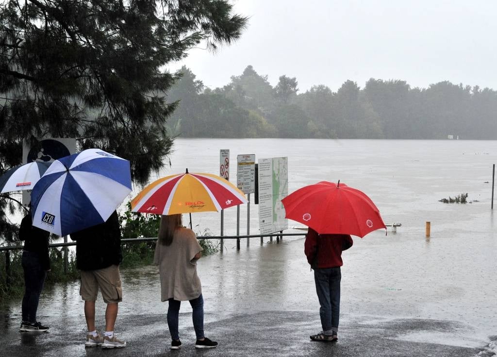 Residents look at the swollen Nepean river during 