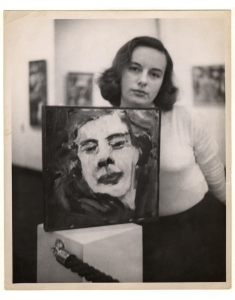 Grace Hartigan poses with a self portrait. She is fondly known as one of the sisters in abstract expressionism.
