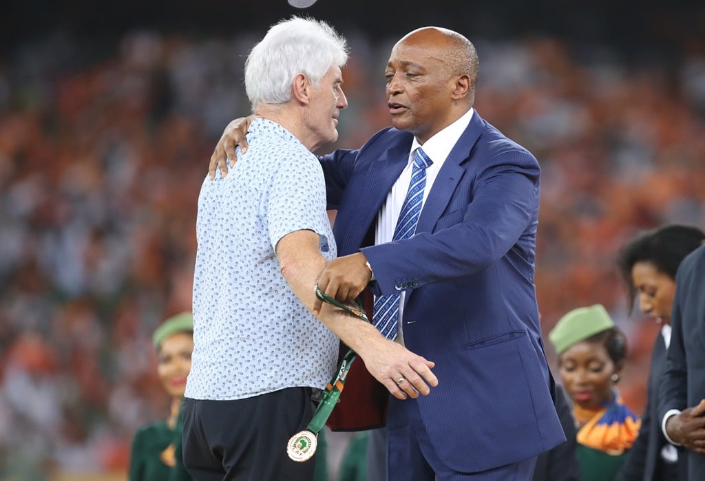 Bafana head coach Hugo Broos receives an Afcon bronze medal from CAF president Patrice Motsepe after the just-concluded tournament in Ivory Coast