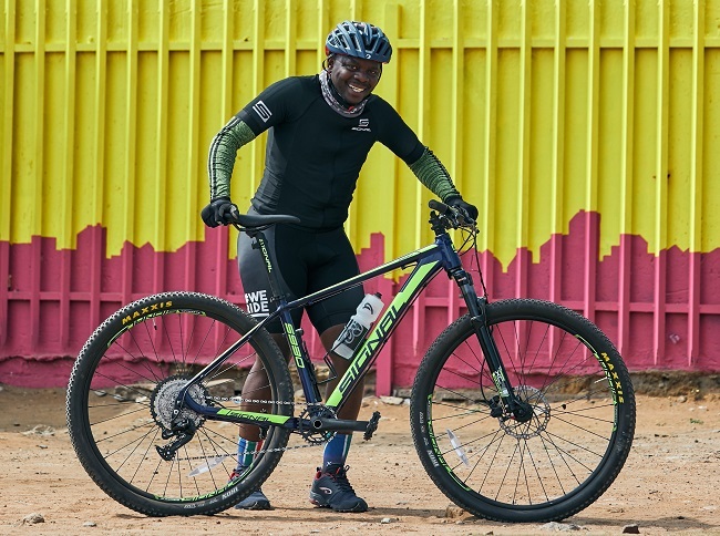 Mpho Nxumalo loves riding in Soweto on his Signal S930 (Photo: @postageagency)