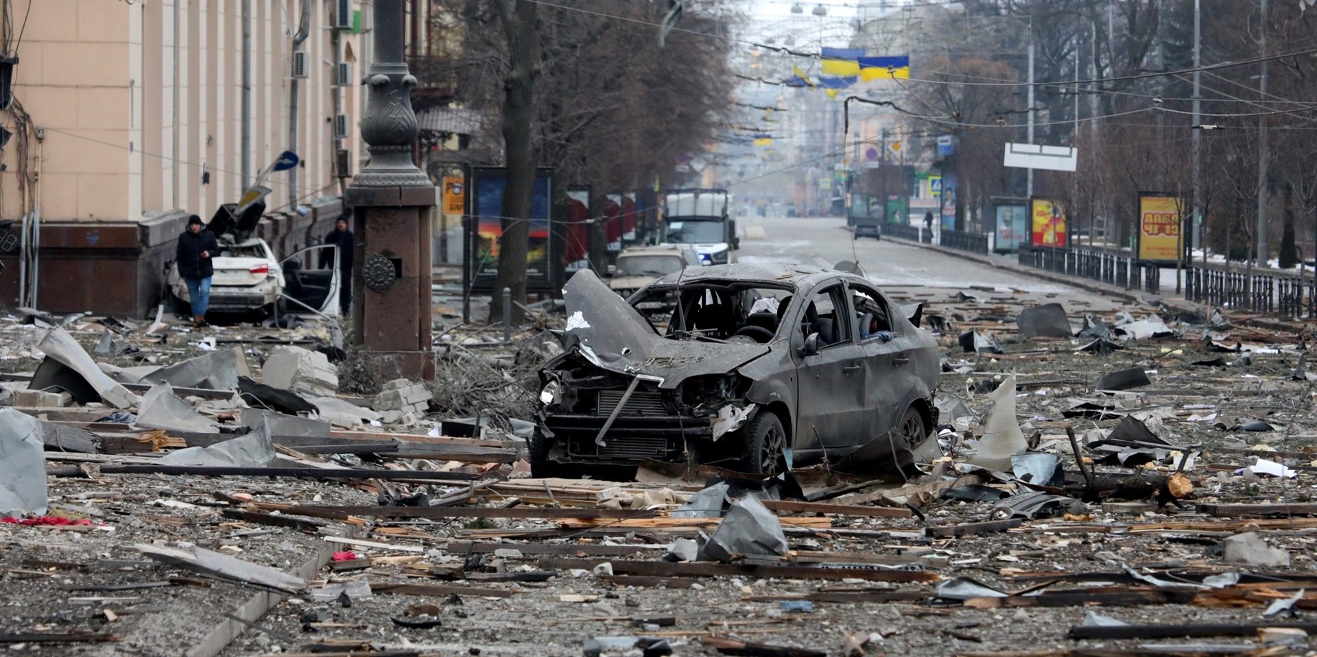 A burnt-out car is seen on the street after a missile launched by Russian invaders hit near the Kharkiv Regional State Administration building in Svobody (Freedom Square) on March 1, 2022, in Kharkiv, Ukraine.
