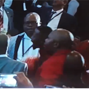 EFF members exchange fists with guards 