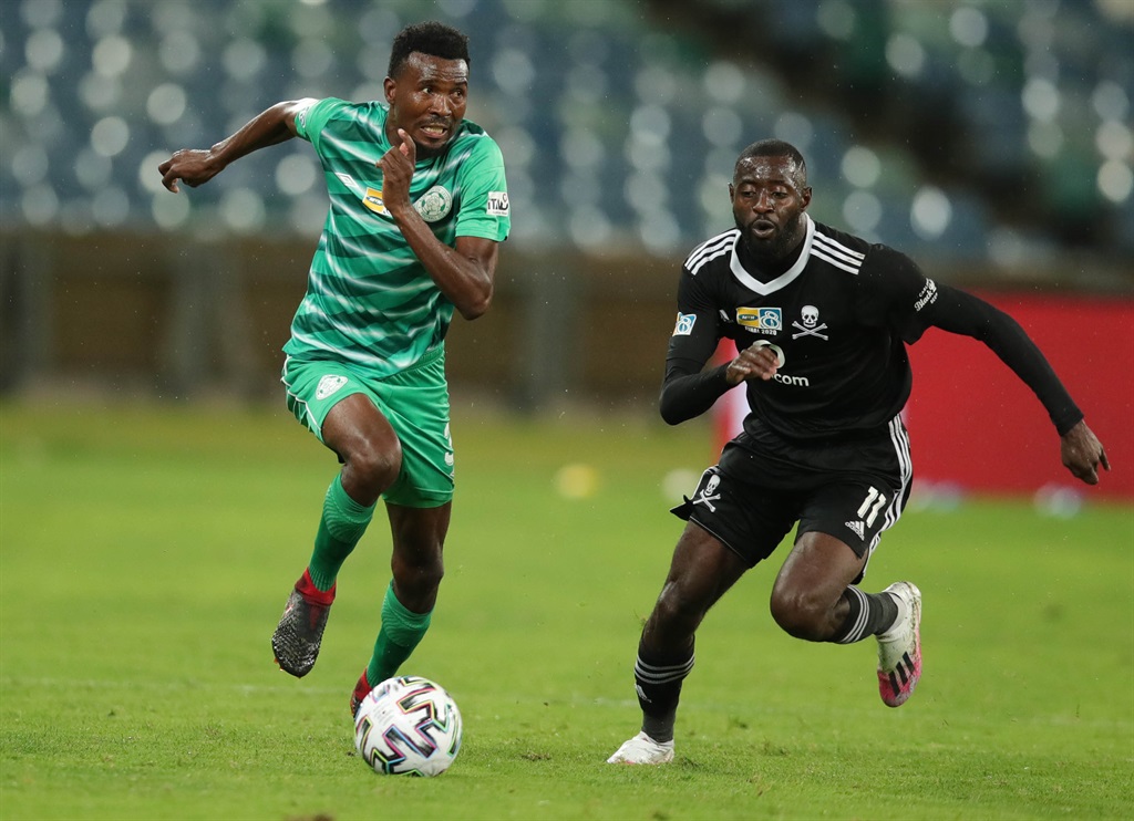 Lucky Baloyi (left) of Bloemfontein Celtic challenged by Deon Hotto of Orlando Pirates.  