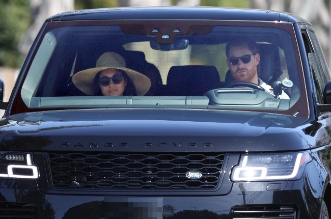A down-cast looking Harry and Meghan were spotted in their Range Rover with Meghan's mom in the backseat on Sunday. (PHOTO: Backgrid/Greatstock)