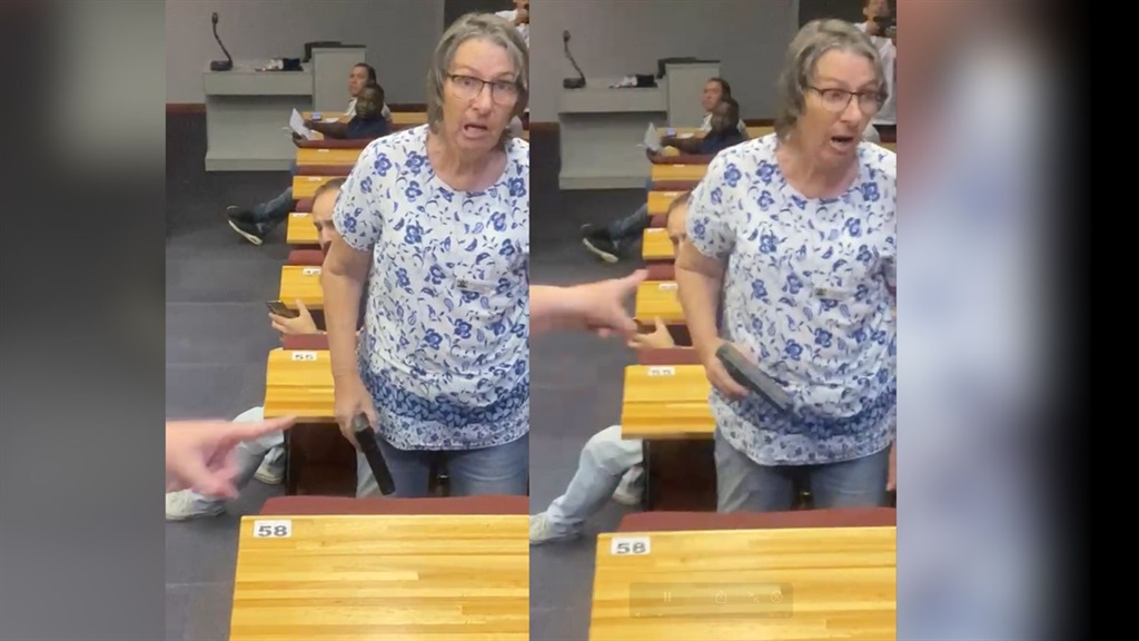 Ward 97 committee member Julia Griffiths pulled what appeared to be a gun on residents association chairperson Martin van der Westhuizen at a heated meeting in Ruimsig, Roodepoort, on Wednesday. The item turned out to be a pepper spray dispenser. (Screenshot)