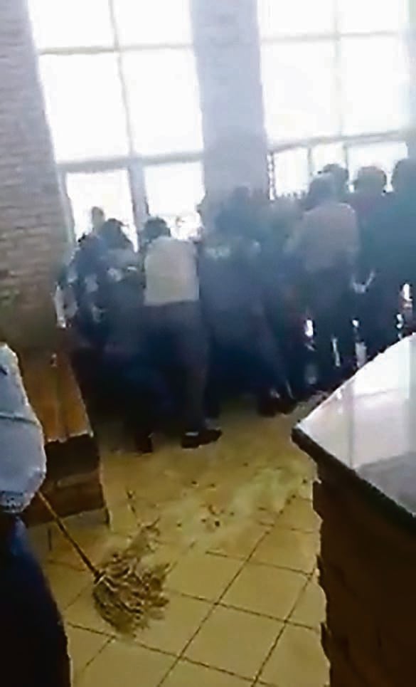 The infamous gangs Boko haram and Vietnam are at war and causing havoc in Jouberton. This screenshot of a video shows one of the gangs storming the local police station.