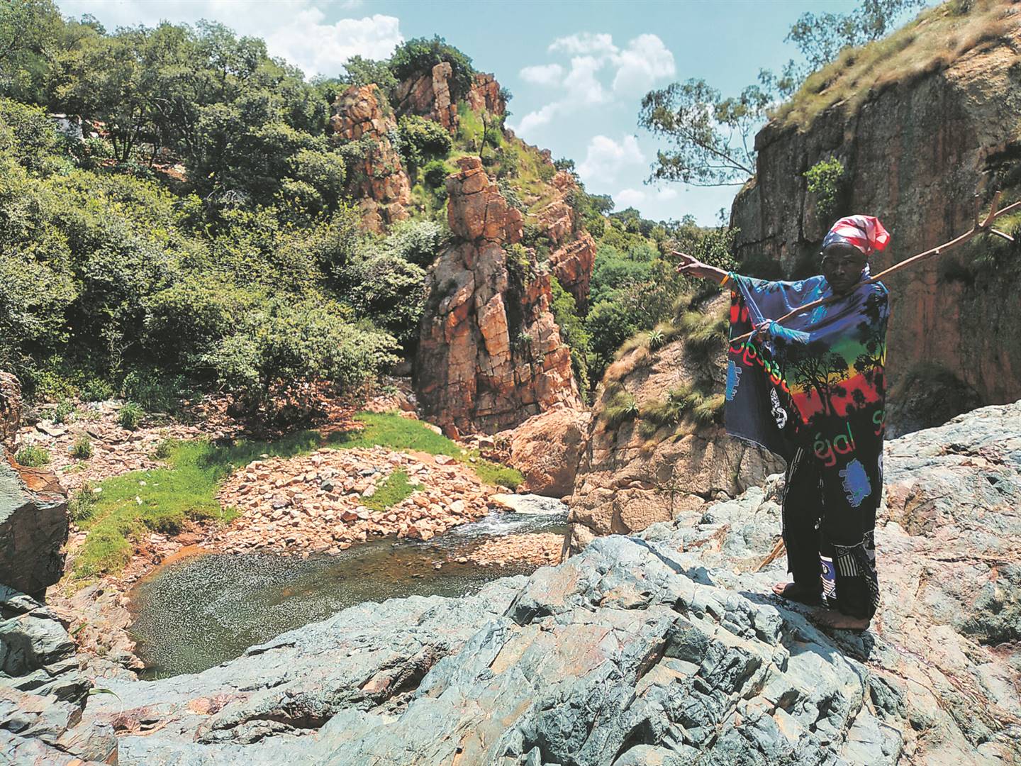 HIDDEN: Sangoma Danger points at his shack situated on a mountain next to the river. Inset: He performs rituals in this river.      Photos by Zamokuhle Mdluli