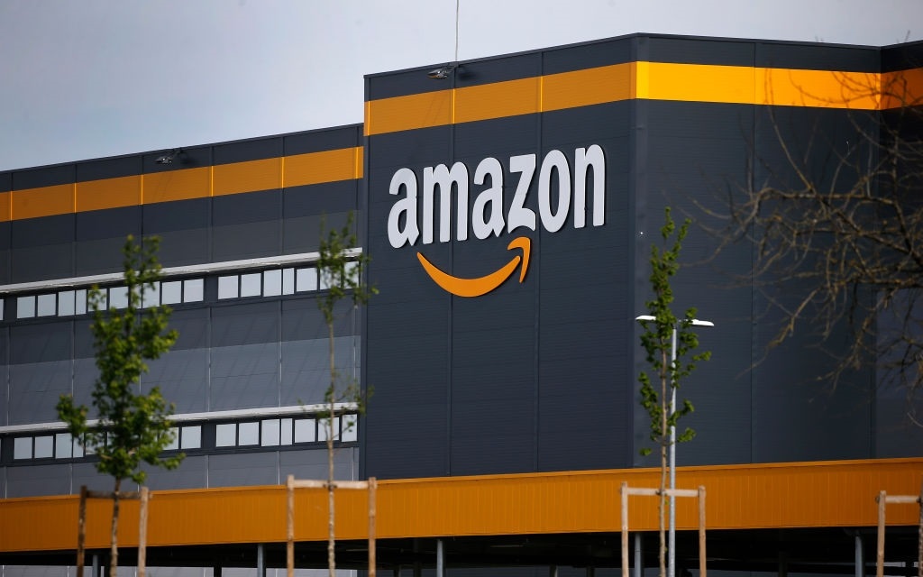 The logo of Amazon is seen on the facade of the company logistics center on April 21, 2020 in Bretigny-sur-Orge, France. 