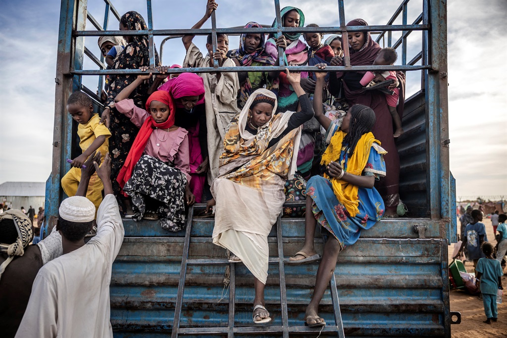 Sudanese refugees get off a truck in Renk, on 13 February 13 2024. More than 550 000 people have fled from the war in Sudan to South Sudan since the conflict exploded in April 2023, according to the United Nations. (Luis Tato /AFP)