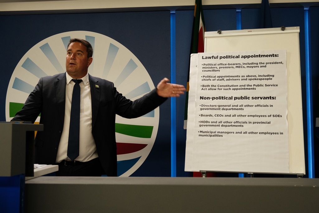 DA leader John Steenhuisen points to a diagram showing the difference between legitimate political appointees and civil servants. 