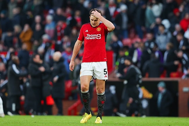 Manchester United's Harry Maguire looks dejected after their Premier League loss to Fulham at Old Trafford on 24 February 2024. (Photo by James Gill - Danehouse/Getty Images)