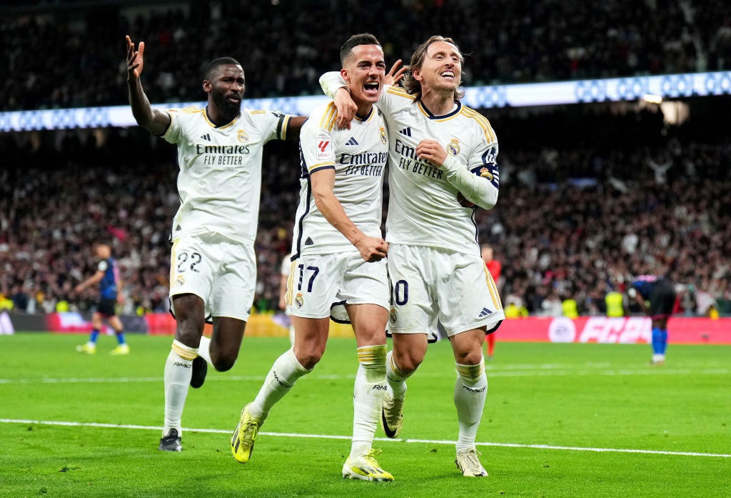 MADRID, SPAIN - FEBRUARY 25: Luka Modric of Real Madrid celebrates scoring his teams first goal with Lucas Vazquez during the LaLiga EA Sports match between Real Madrid CF and Sevilla FC at Estadio Santiago Bernabeu on February 25, 2024 in Madrid, Spain. (Photo by Angel Martinez/Getty Images)