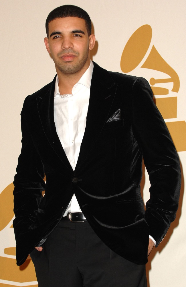 Drake kept it simple in a black suit and white shi