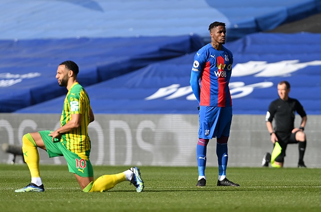 Crystal Palace's Wilfried Zaha stands prior to kick off in their Premier League match against West Bromwich Albion at Selhurst Park on 13 March 2021. (Photo by Mike Hewitt/Getty Images)