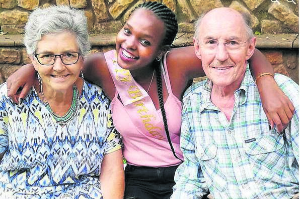 Mandise Mlitwi with her parents Sandra MacLaren and Roy Reed.