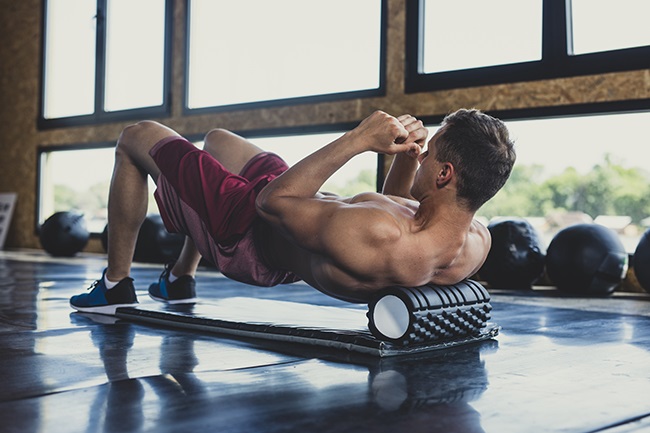 After an intense bout of exercise, foam rolling can alleviate muscle fatigue and soreness. (Photo: Getty Images)