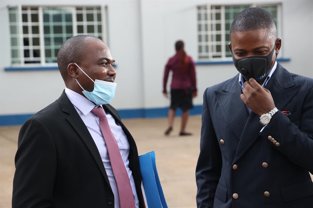 Bushiri with his lawyer, Wapona Kita outside a Malawi court