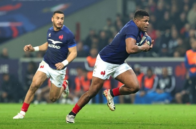 France centre Jonathan Danty, right, runs with the ball during the Six Nations match against Italy at Stade Pierre Mauroy in Lille on Sunday. (Photo by David Rogers/Getty Images)