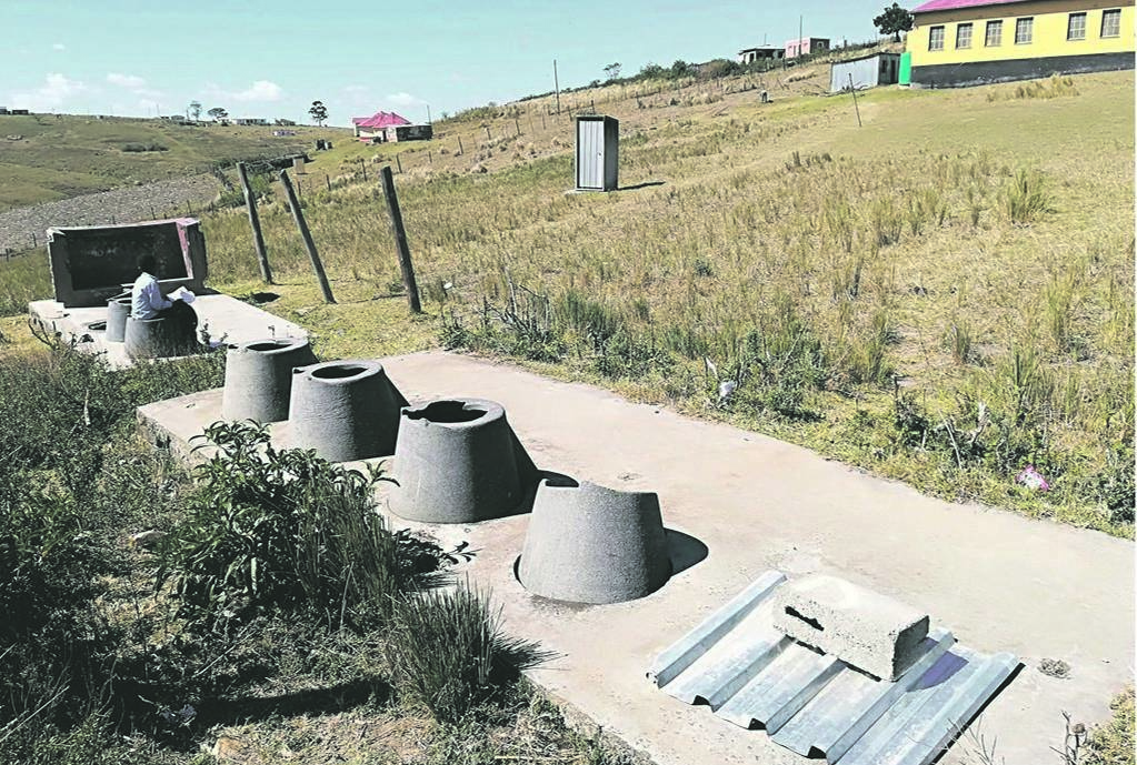 A child uses a pit toilet at a school in the Eastern Cape.