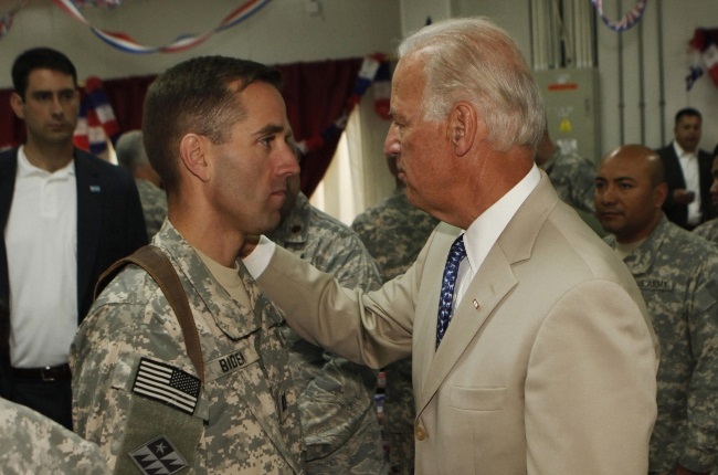 Joe Biden chats with his son during a visit to Iraq as vice president in 2009. At the time Beau was serving as a captain in the US army. Picture: Gallo Images/Getty Images
