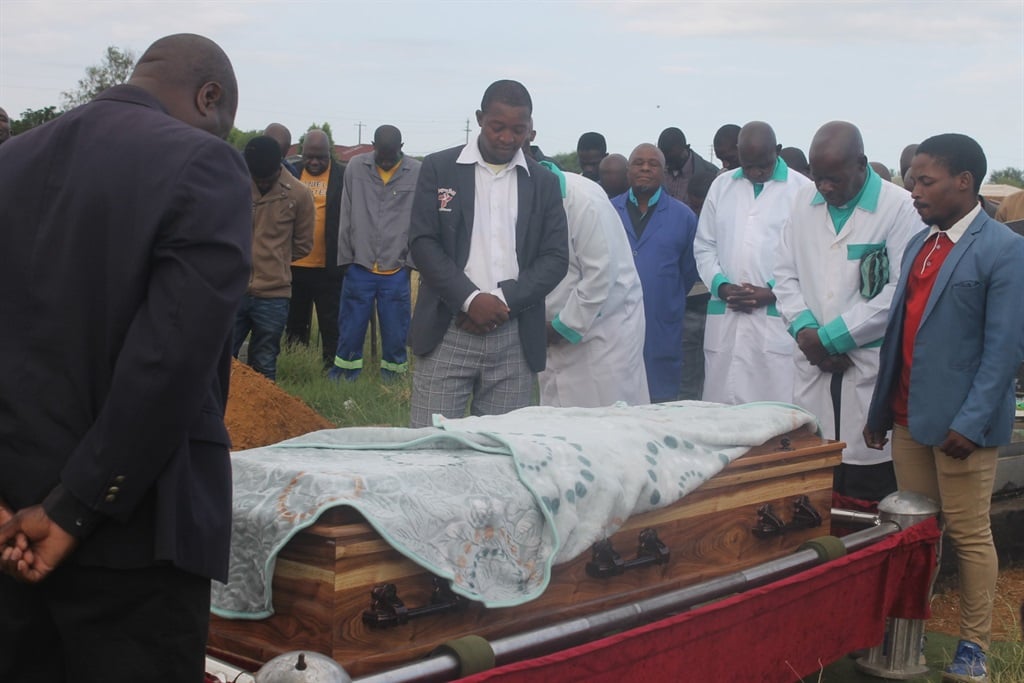 Thomas Maluleka's grieving family and pastors praying for his soul to rest in peace and abahlali came out in numbers to the funeral on Wednesday. Photo by Thokozile Mnguni