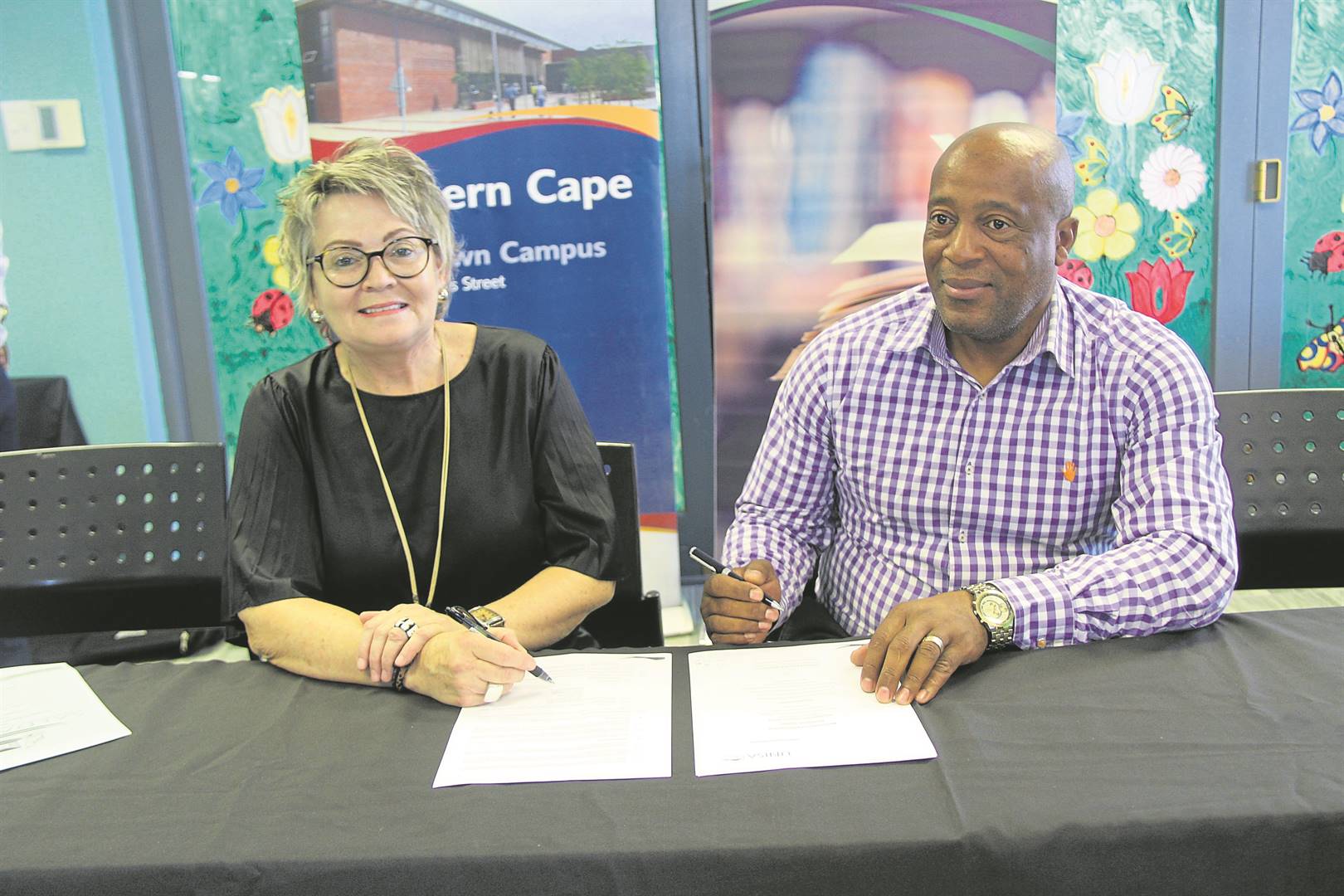 Signing of the partnership. Pictured is Michelle Frauendorf, Unisa Cape Town Campus Acting Regional Director and Phumzile Mbaliswana, Director of Corporate and Public Safety Services.Photo: Noluvu Ludidi