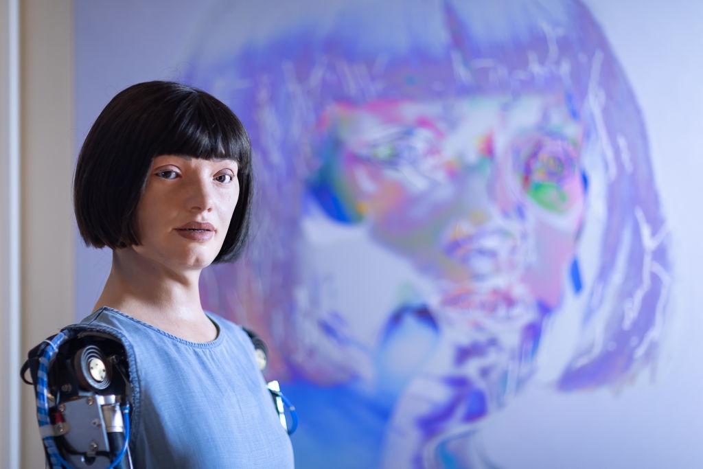 Ai-Da stands in front of one of her artworks during Ai-Da: The Worlds First Robot Artist press view at Design Museum in London, England. (Photo: Tim P. Whitby/Getty Images)