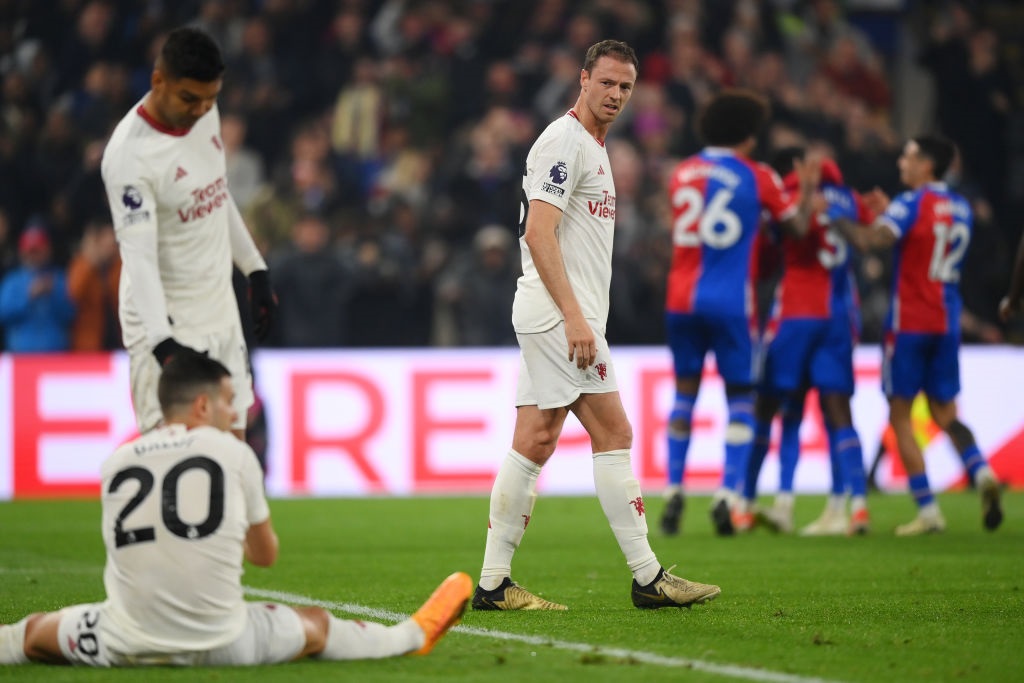 LONDON, ENGLAND - MAY 06: Jonny Evans of Manchester United looks dejected as he looks back towards Casemiro and Diogo Dalot after Tyrick Mitchell of Crystal Palace (not pictured) scored his teams third goal during the Premier League match between Crystal Palace and Manchester United at Selhurst Park on May 06, 2024 in London, England. (Photo by Justin Setterfield/Getty Images)
