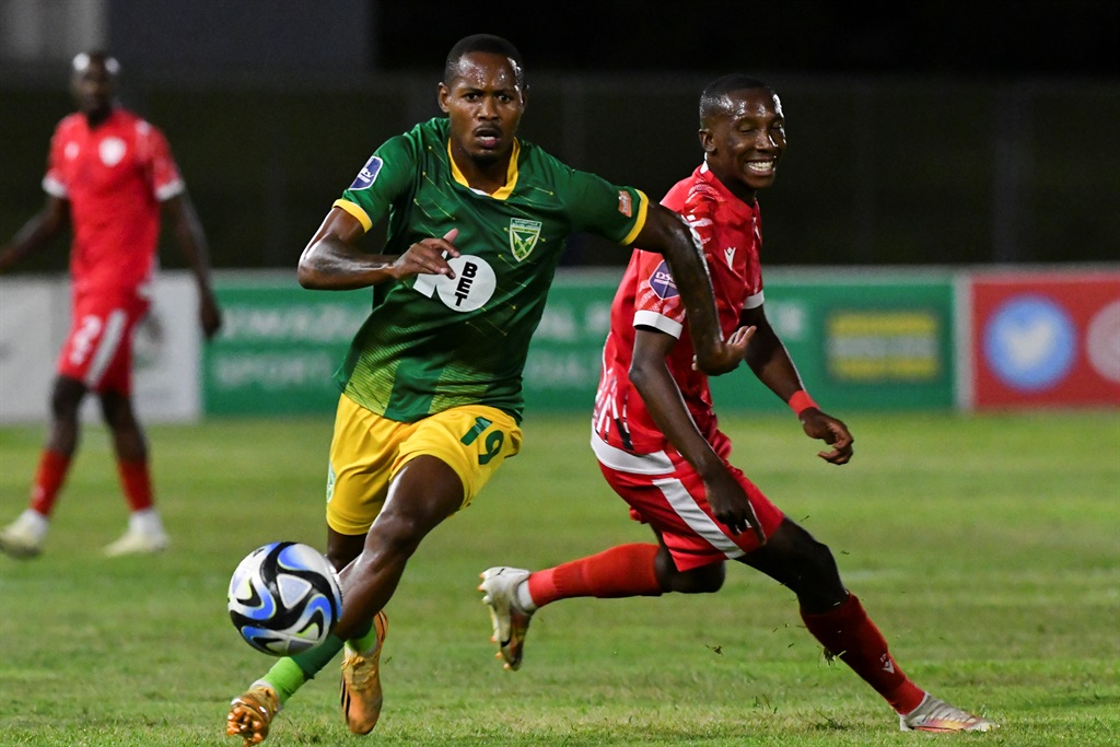 HAMMERSDALE, SOUTH AFRICA - FEBRUARY 28: Sibusiso Sibeko of Golden Arrows FC and Elias Mokwana of Sekhukhune United during the DStv Premiership match between Golden Arrows and Sekhukhune United at Mpumalanga Stadium on February 28, 2024 in Hammersdale, South Africa. (Photo by Darren Stewart/Gallo Images)