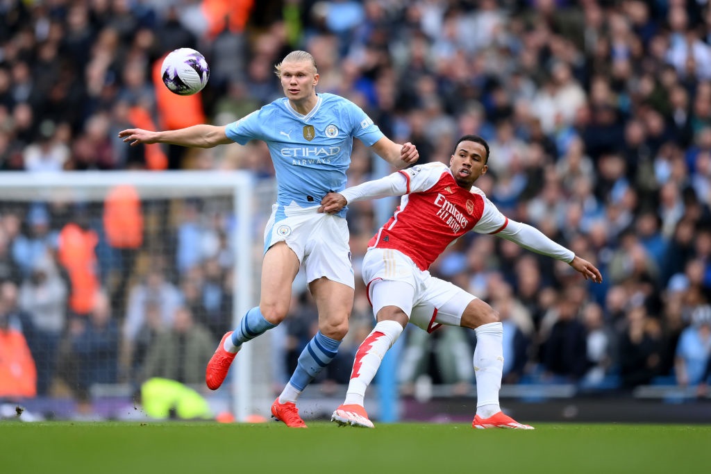 MANCHESTER, ENGLAND - MARCH 31: Erling Haaland of Manchester City is challenged by Gabriel of Arsenal during the Premier League match between Manchester City and Arsenal FC at Etihad Stadium on March 31, 2024 in Manchester, England. (Photo by Justin Setterfield/Getty Images) (Photo by Justin Setterfield/Getty Images)