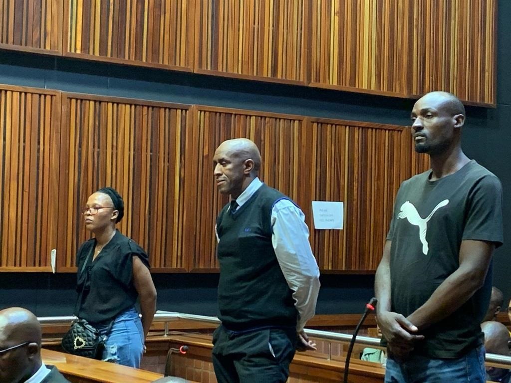 A warrant of arrest has been issued for former cop Simon Ndyalvane flanked by co-accused Caylene Whiteboy and Voster Netshiongolo. 