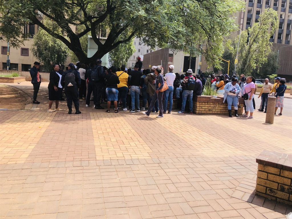 City of Joburg security officers gathered at Library Gardens to plan the march to the city manager. Photo by Sylvester Sibiya