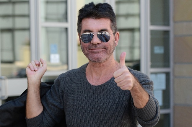 Simon Cowell showed off his incredible weight loss in a grey t-shirt and white shorts. (Photo: GALLO IMAGES/GETTY IMAGES) 