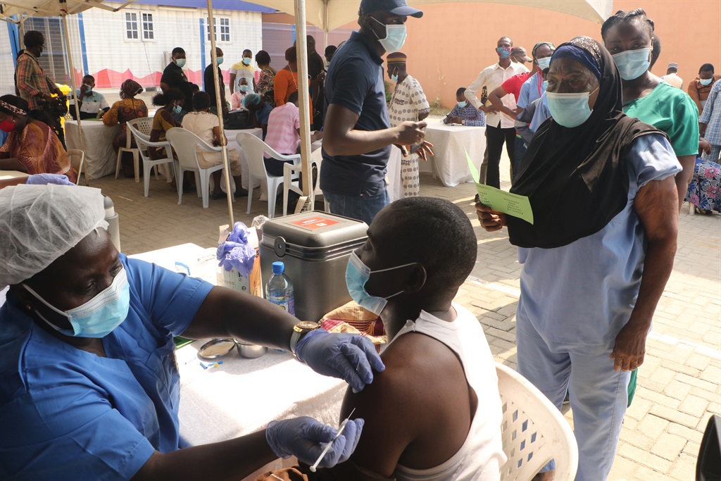 People queue to receive first dose of the Oxford/AstraZeneca coronavirus disease (Covid-19) vaccine at the Cacovid isolation centre, Mainland, Infectious disease hospital, Yaba, in Lagos, Nigeria.