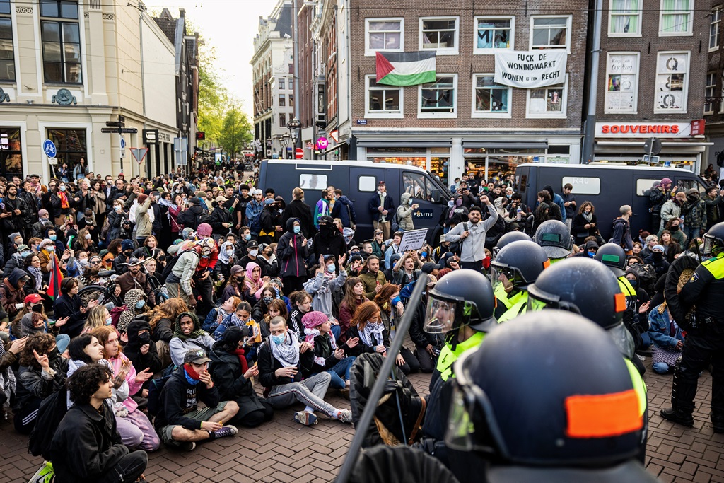 Dutch Police officers stand guard in front of demo
