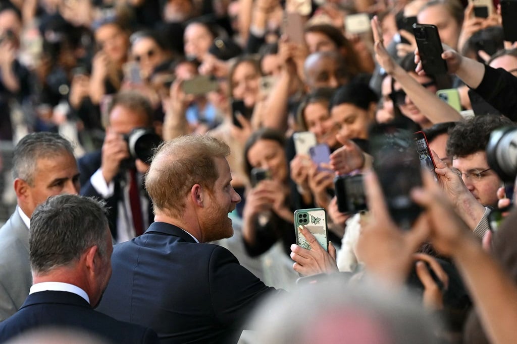 Britain's Prince Harry, Duke of Sussex greets well