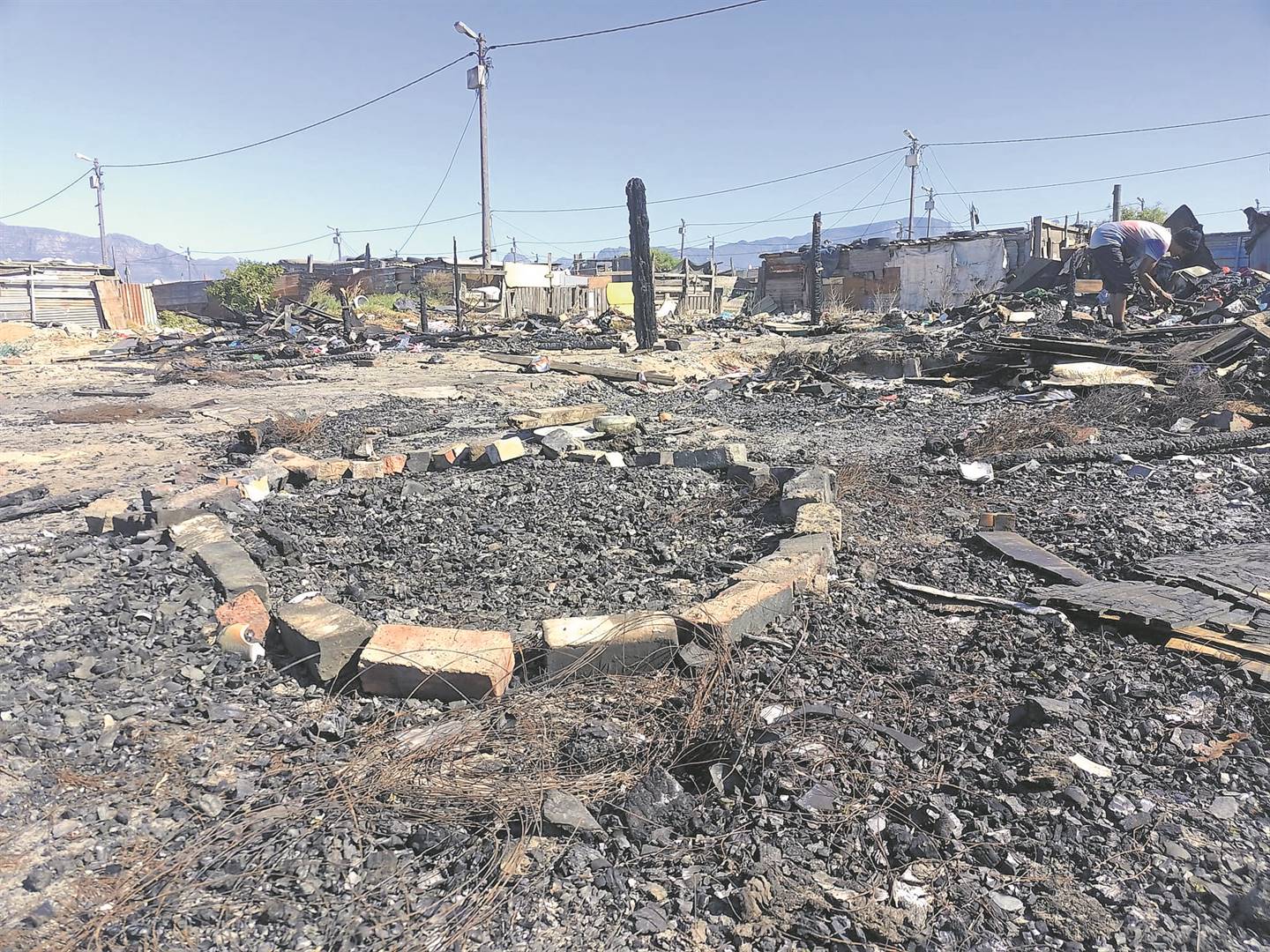A brick circle marks the spot where Zane Fouten’s body was found after a fire destroyed his Montague Village home. PHOTOS: Natasha Bezuidenhout