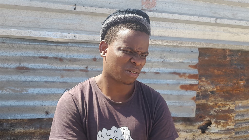 Abongile Maseti is happy to be alive after a fire started from his bed in Gugulethu. Photo by Lulekwa Mbadamane