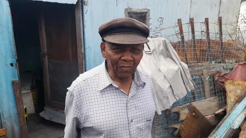 Madala Heavystone Tyelinzima Sipopo, who said he was saved by people who threw stones on top of his shack when the fire was approaching. Photo by Lulekwa Mbadamane