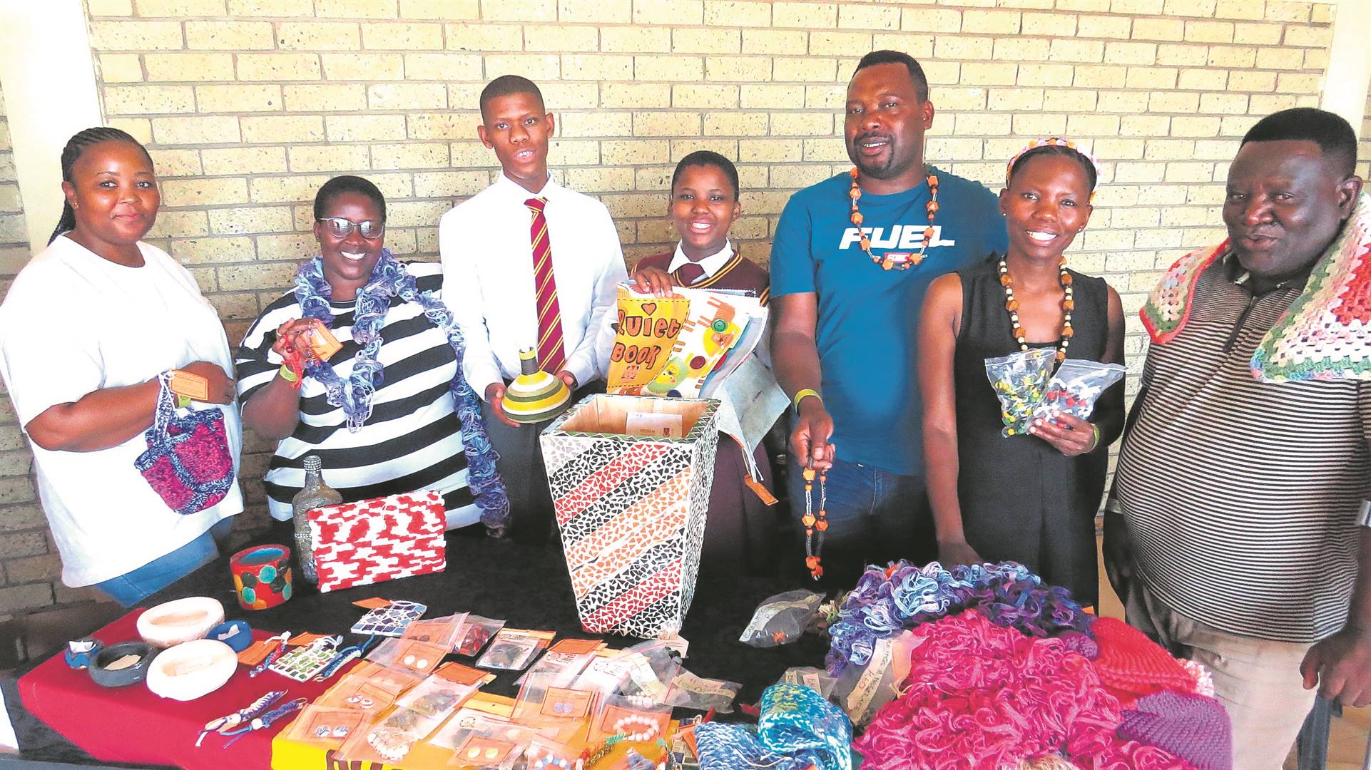 The Pholoho Special School in Bloemfontein continues to showcase its learners’ abilities through a skills training project, with the latest offerings exhibited during the disability awareness campaign held at the Norman Doubell Hall in Heidedal on 23 February. Representatives of the school are from the left: Mosele Mokhele (house supervisor), Dinah Motsumi, Tokologo Modutwane (learner), Palesa Stellenberg (learner), Khathatso Bohloko, Matshediso Phalatsane and Benard Tshabalala. Learners produce a range of contemporary handcrafted items, jewelry like necklaces and earrings, beads, as well as household items such as flower pots.Photo: Teboho Setena