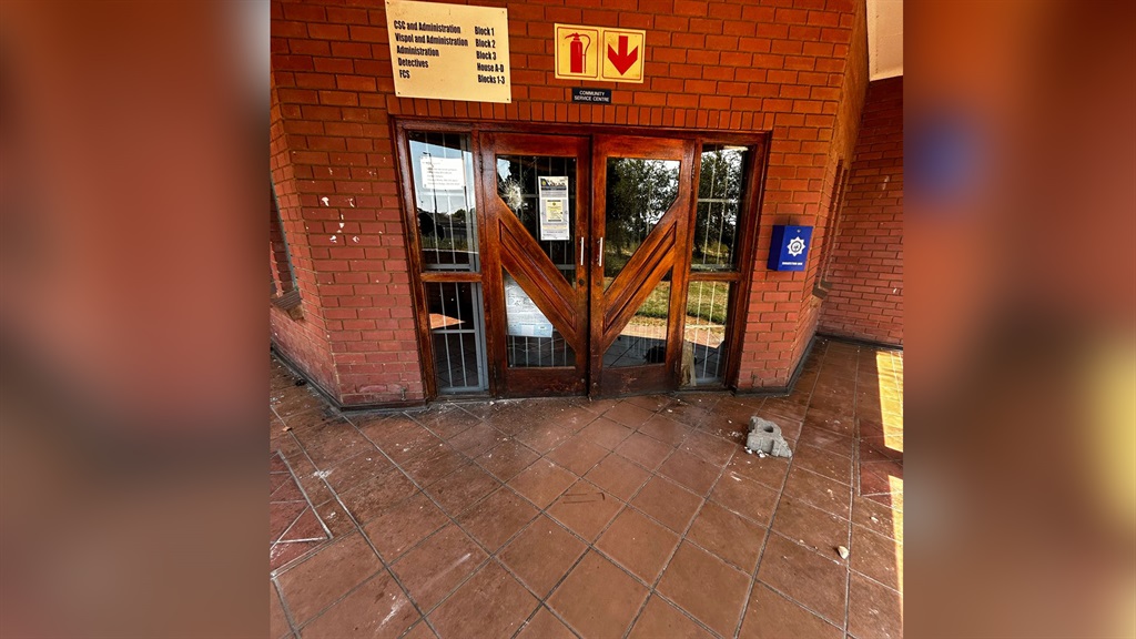 Rocks and shattered beer bottles were strewn around the station's reception entrance. (Alex Mitchley/News24)