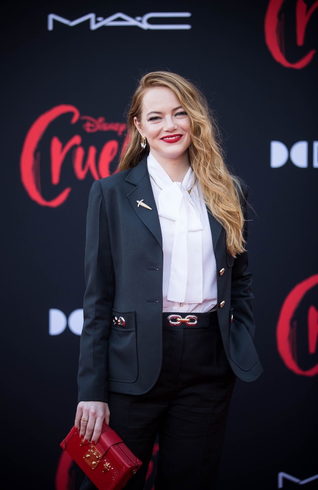 Emma Stone appeared to relish being back on the red carpet at the world premiere of Cruella in Hollywood earlier this week. The actress looked chic in a black tailored suit with gold buttons and gold chain embellishments. (PHOTO: Gallo Images/Getty Images)