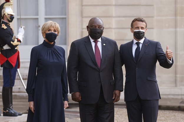 France's president Emmanuel Macron, his wife Brigitte Macron, with Cyril Ramaphosa upon his arrival for a dinner at the Elysee Presidential Palace in Paris. 
