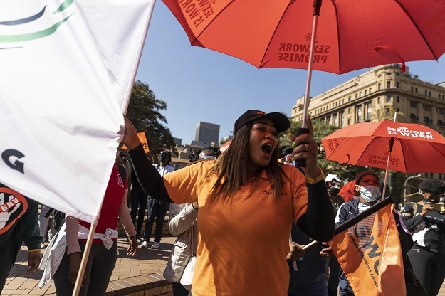 Sex workers and supporters shout and sing slogans at a march in solidarity with sex workers set on decriminalising the trade in Johannesburg.