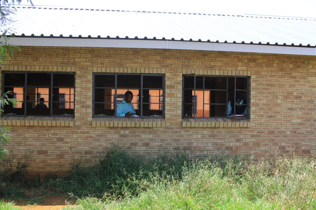 Pupils at this school learn in unfinished classrooms. Photo by Tumelo Mofokeng