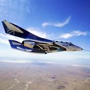 Branson plans first space trip days before Bezos blasts off