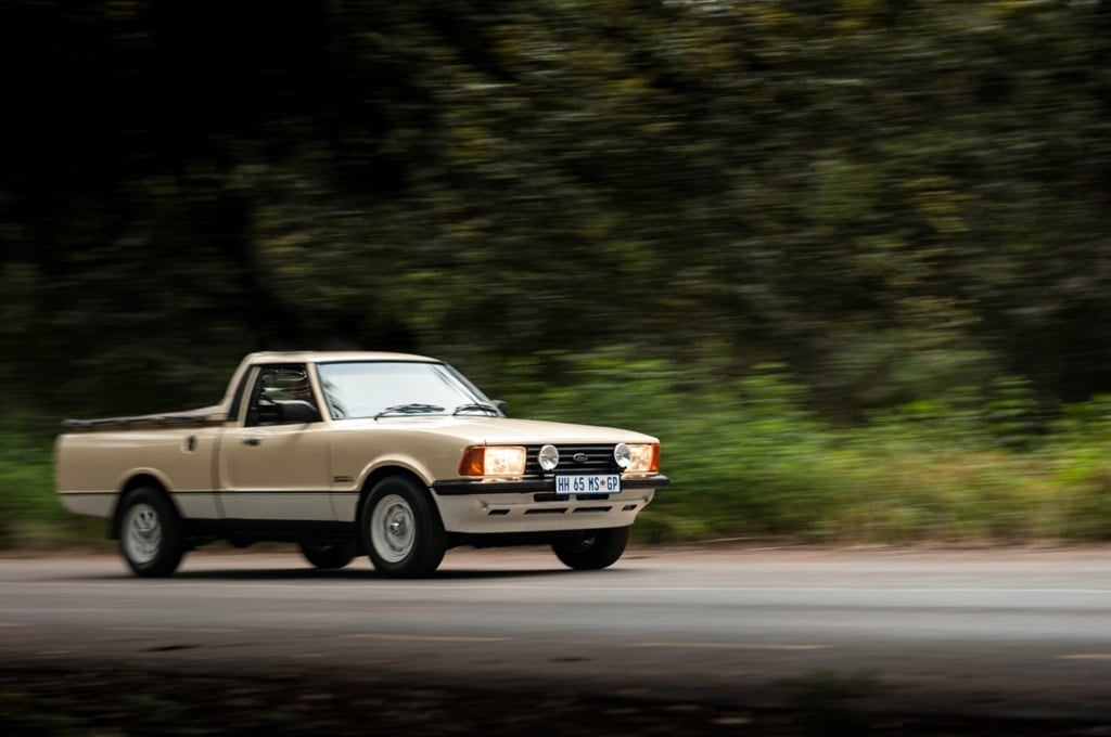 1980 Ford Cortina Mark V 3000L Leisure bakkie action shot on scenic road. [Image: Quickpic]